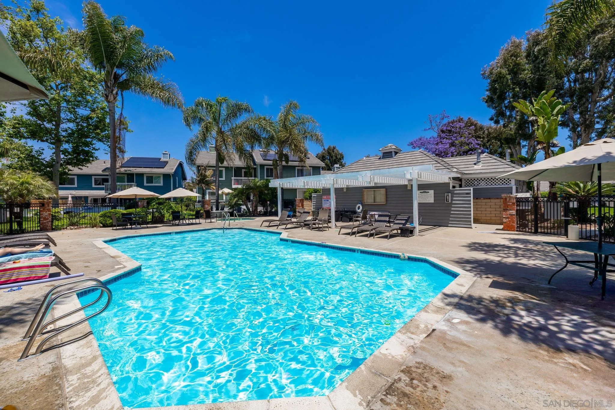 677 Summer View Circle Encinitas, CA 92024 - Photo 41 of 58 a front view of a house with swimming pool garden and patio