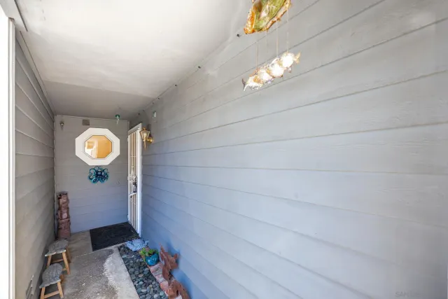 a bathroom with a sink mirror and vanity