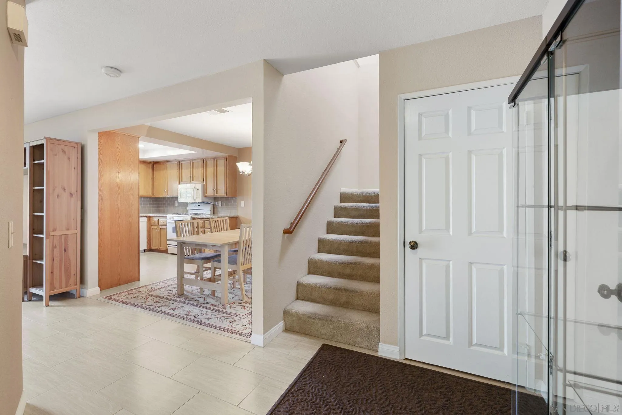 677 Summer View Circle Encinitas, CA 92024 - Photo 6 of 58 a view of a hallway with wooden floor and staircase