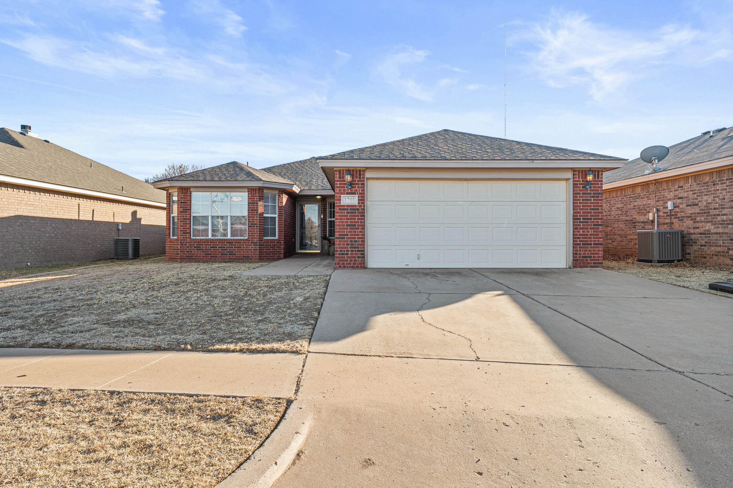 1701 79th Street Lubbock, TX 79423 - Photo 1 of 26 front view of a house with a yard