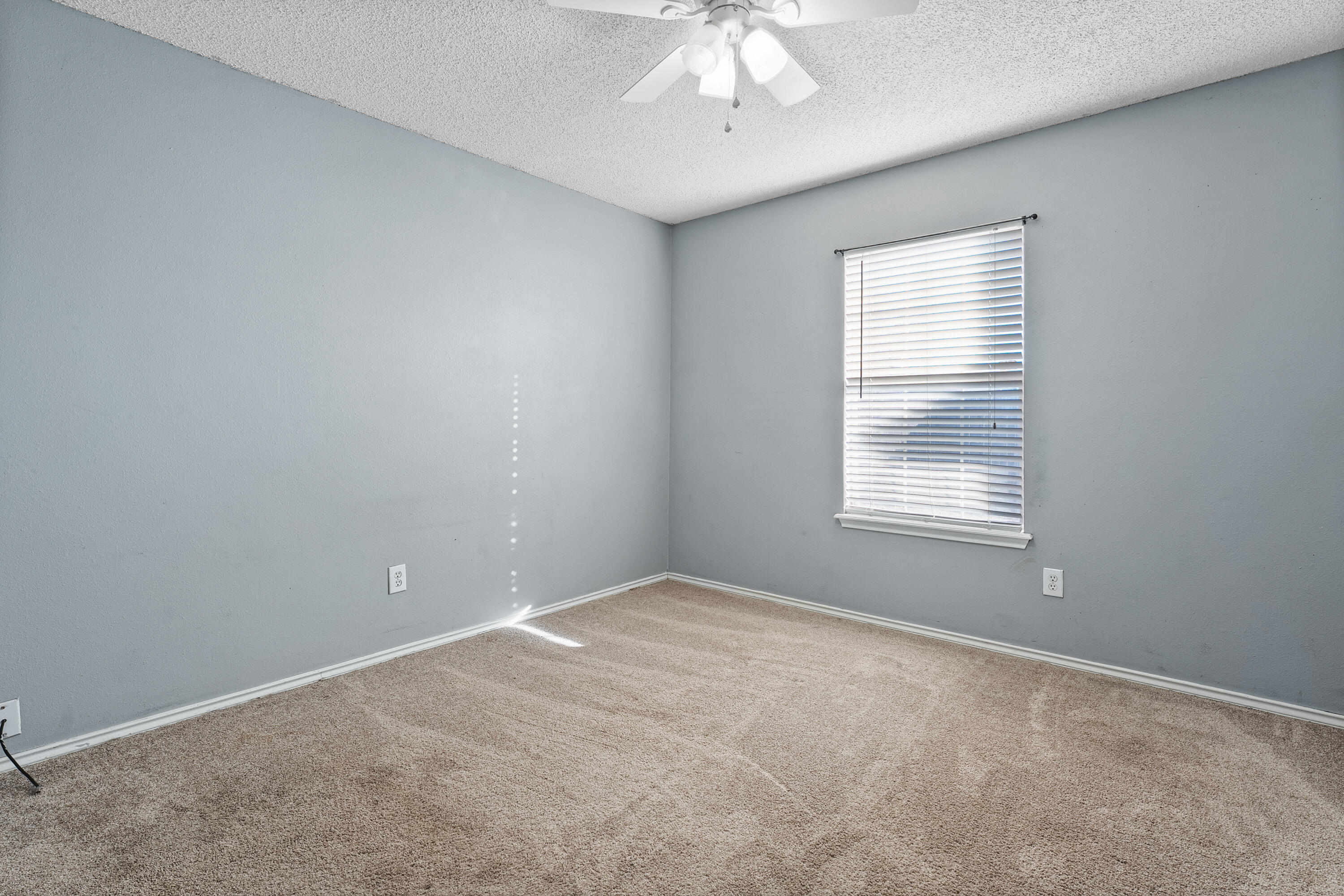 1701 79th Street Lubbock, TX 79423 - Photo 21 of 26 a view of an empty room with a window