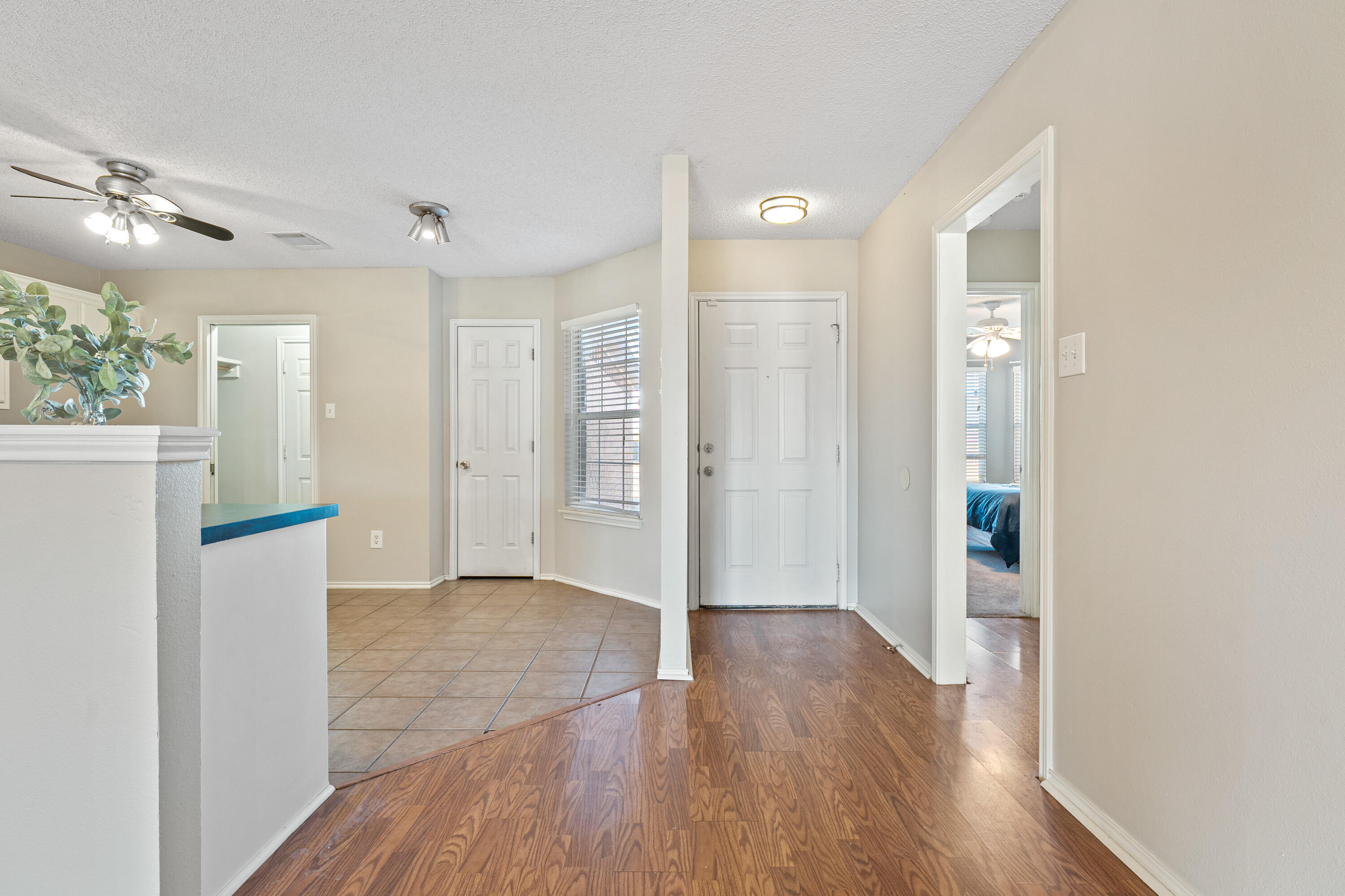 1701 79th Street Lubbock, TX 79423 - Photo 3 of 26 a view of a big room with wooden floor and a bathroom