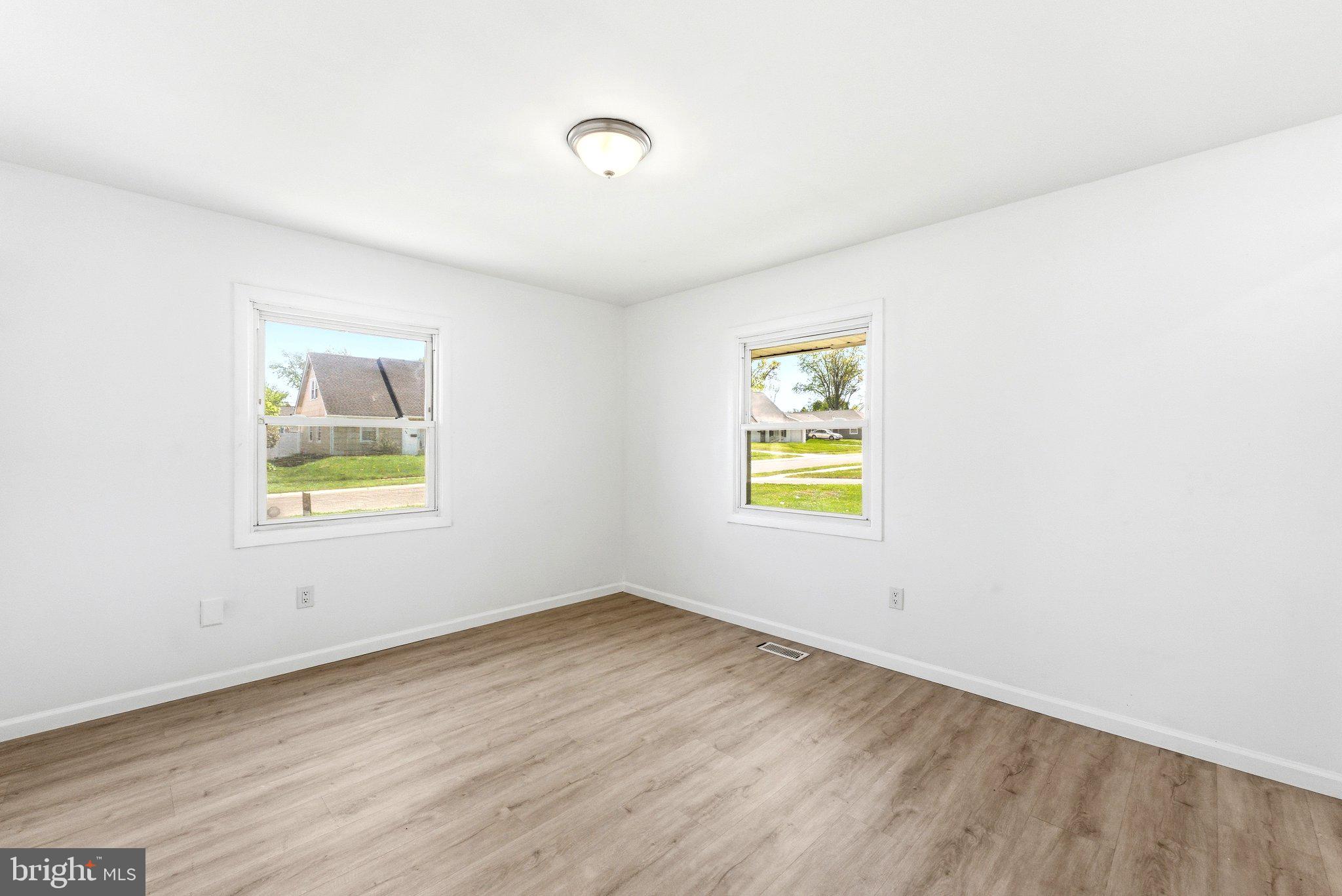 49 Middleton Lane Willingboro, NJ 08046 - Photo 18 of 23 a view of an empty room with wooden floor and a window