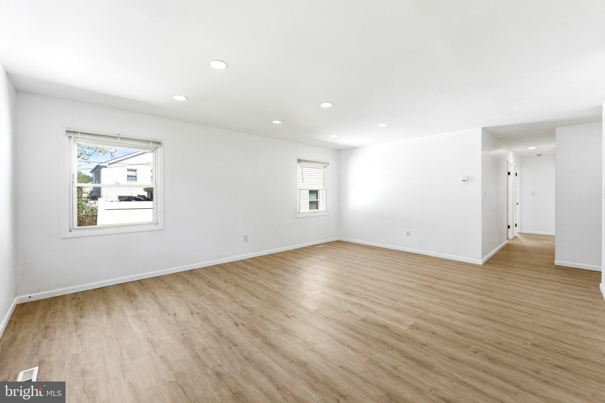 49 Middleton Lane Willingboro, NJ 08046 - Photo 10 of 23 an empty room with wooden floor and windows