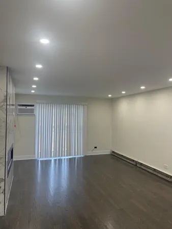 a view of hallway with wooden floor