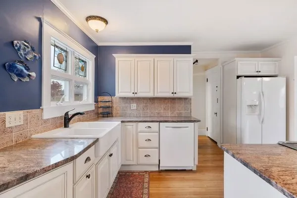 a kitchen with lots of counter top space and dining table