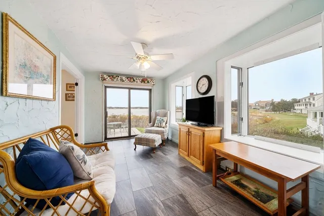 a living room with furniture fireplace and a fireplace