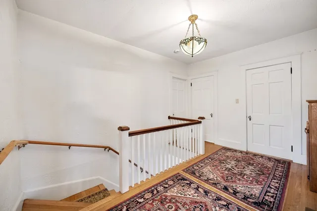 a bed room with a bed and a chandelier