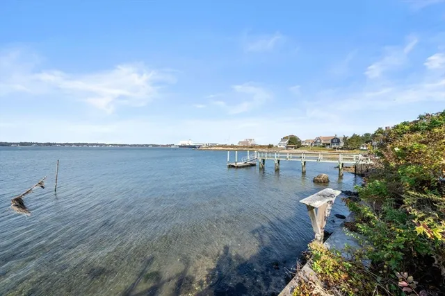 a aerial view of a house next to a yard