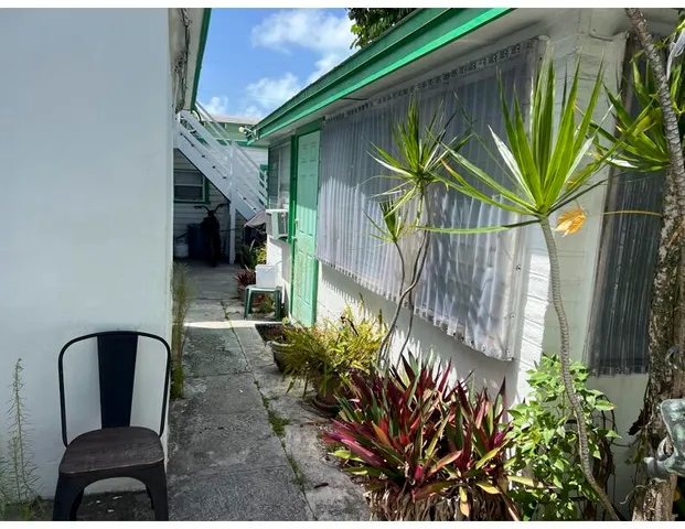 a view of outdoor seating and deck in the backyard