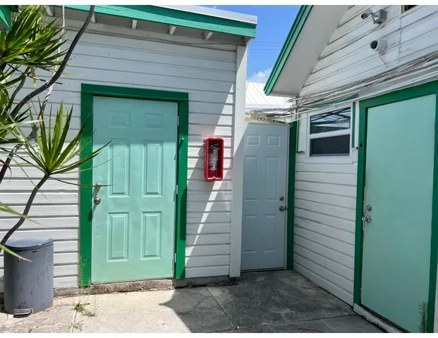 a view of a house with backyard and deck