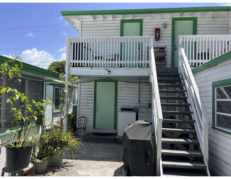 720-726 Emma Street Key West, FL 33040 - Photo 8 of 10 a view of a house with backyard and deck