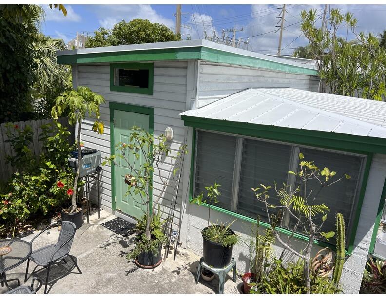 720-726 Emma Street Key West, FL 33040 - Photo 9 of 10 a front view of a house with garden