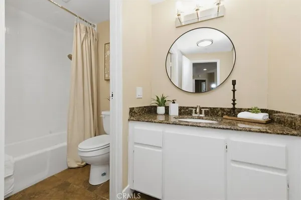 walk in closet with white cabinet