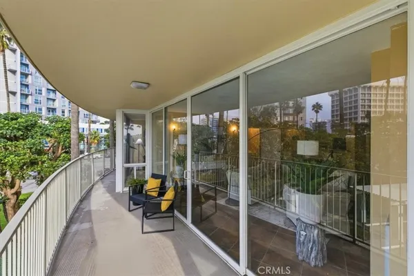 a view of a patio with a table and chairs in patio