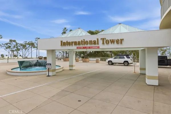 a view of a hallway with table and a potted plant