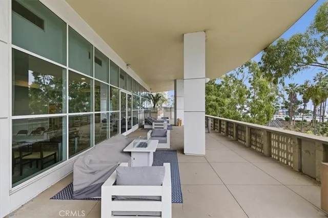 a view of a terrace with palm trees