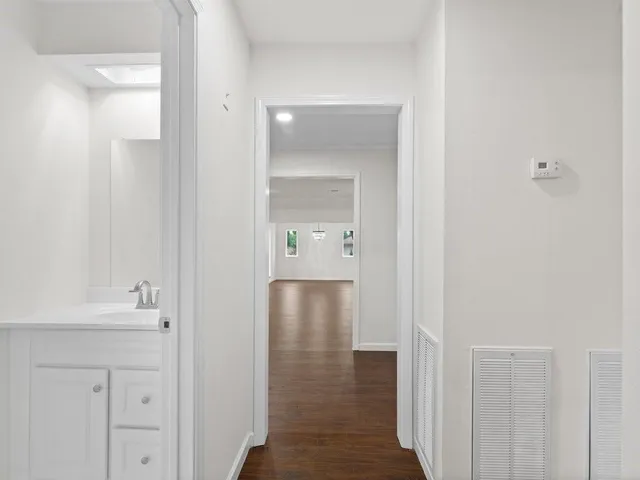 a view of a bathroom from the hallway