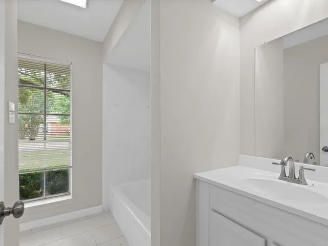 a bathroom with a sink and a bathtub