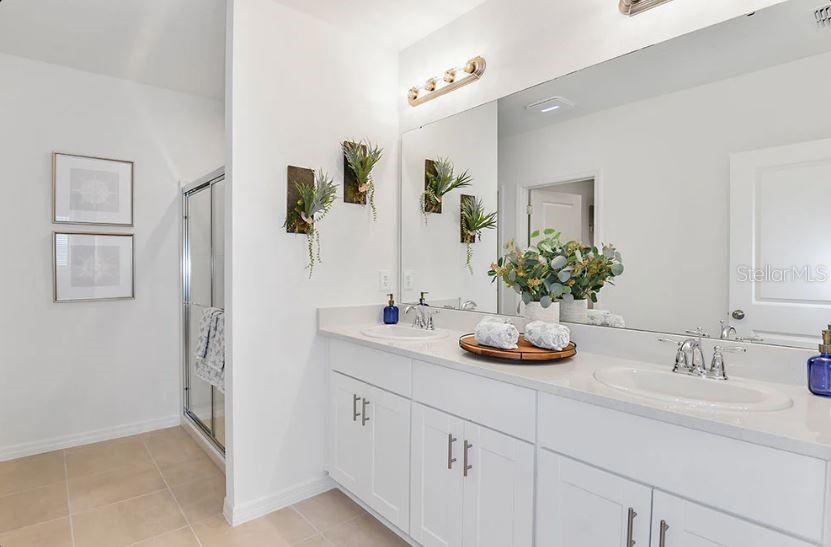 13815 Sawmill Street Parrish, FL 34219 - Photo 16 of 25 a bathroom with a sink and a mirror
