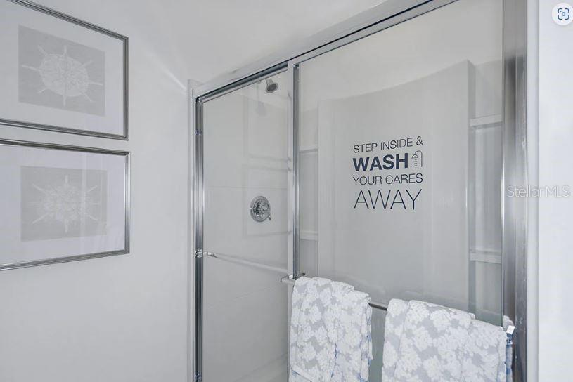 13815 Sawmill Street Parrish, FL 34219 - Photo 18 of 25 a bathroom with a shower and a sink