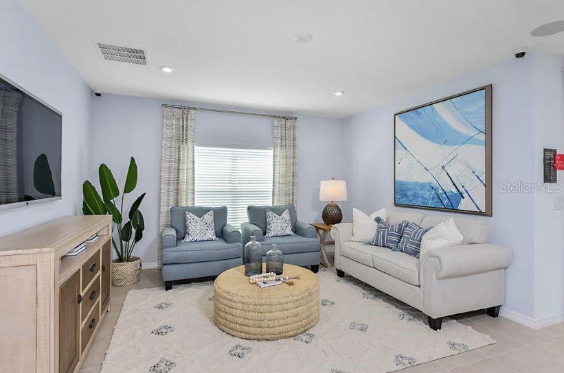 13815 Sawmill Street Parrish, FL 34219 - Photo 5 of 25 a living room with furniture and a fireplace