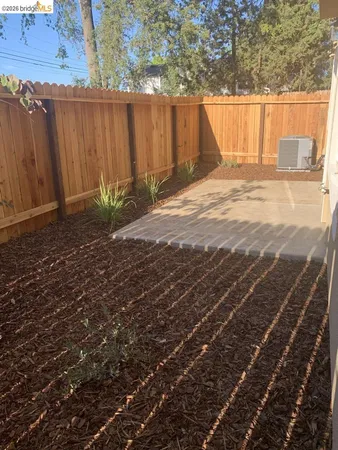 a view of a backyard of the house