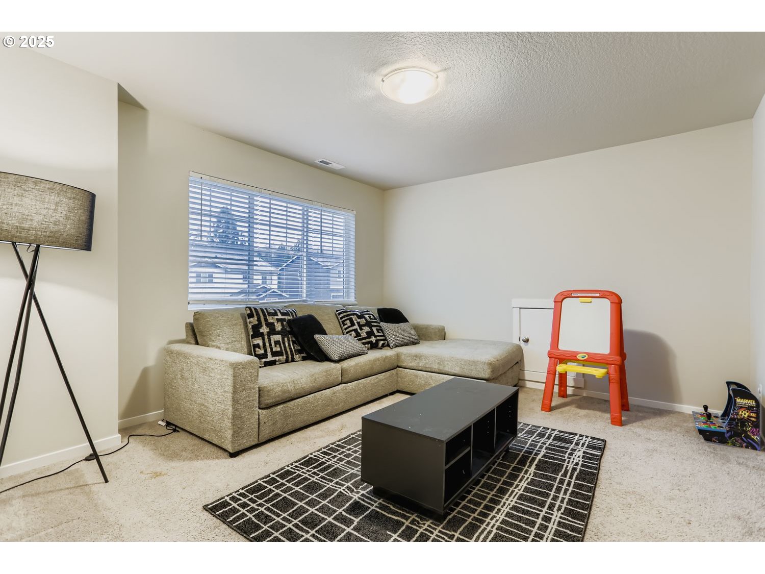 15295 Southeast Flavel Street Portland, OR 97236 - Photo 19 of 26 a living room with furniture and a rug