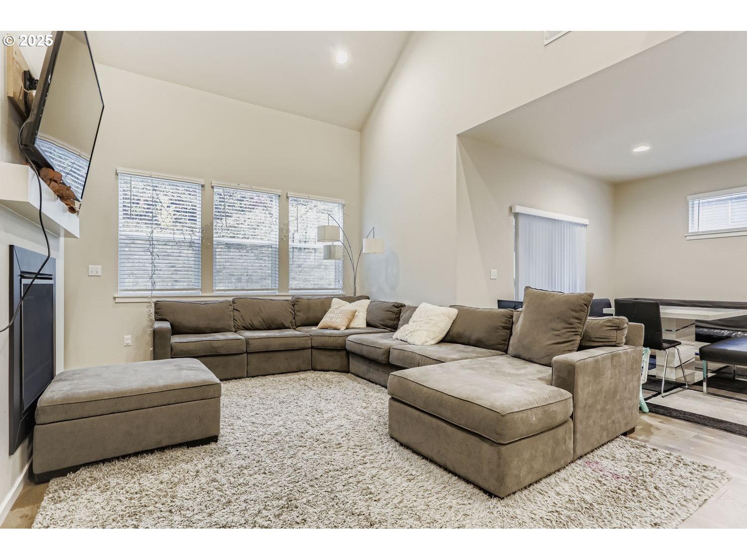 15295 Southeast Flavel Street Portland, OR 97236 - Photo 6 of 26 a living room with furniture and a flat screen tv