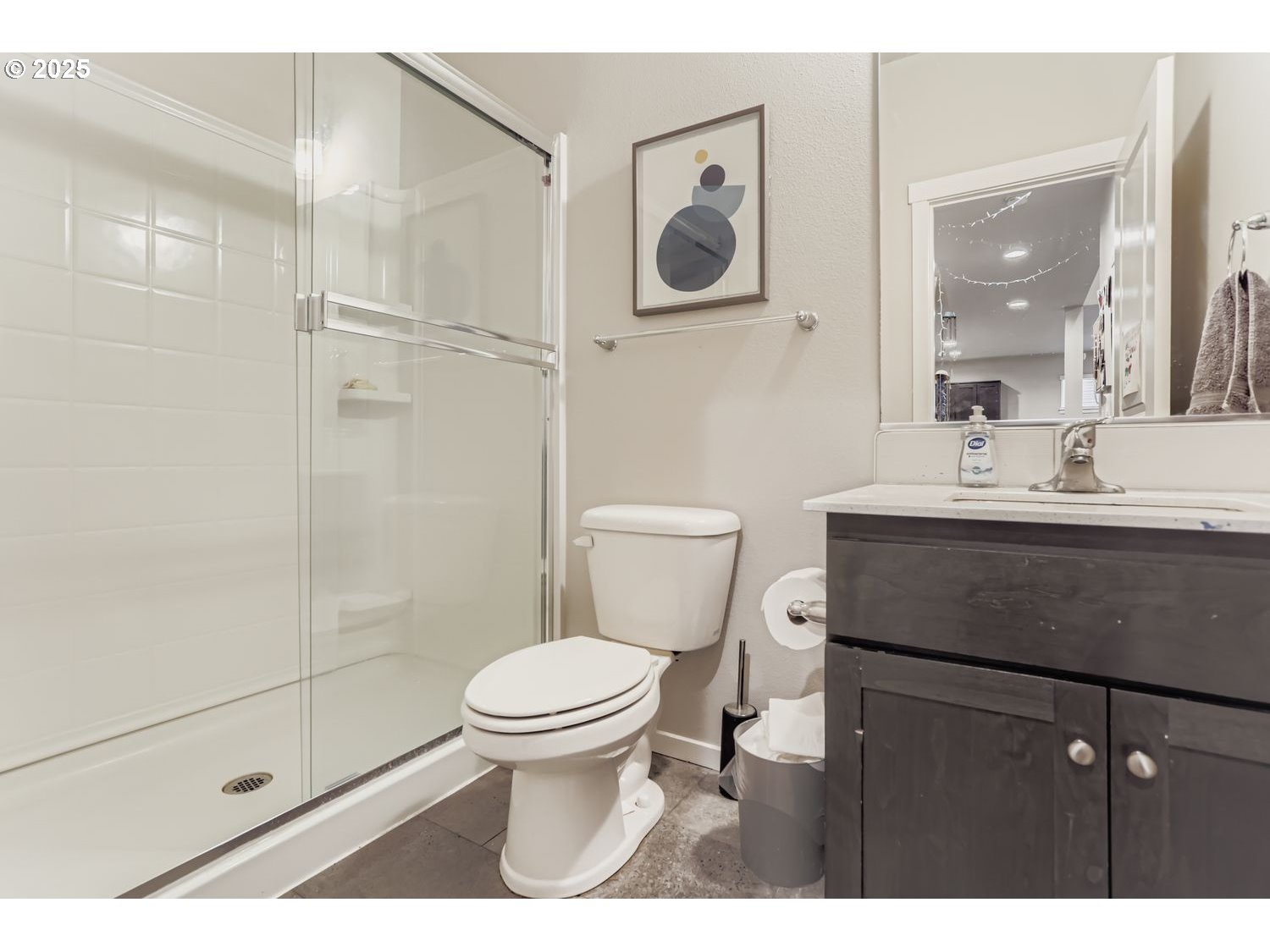 15295 Southeast Flavel Street Portland, OR 97236 - Photo 8 of 26 a bathroom with a sink toilet vanity and shower