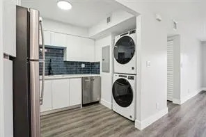 a view of a kitchen with washer and dryer