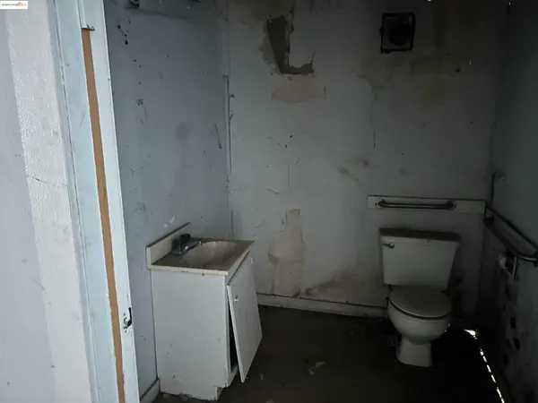 a view of a yard covered with snow in front of house