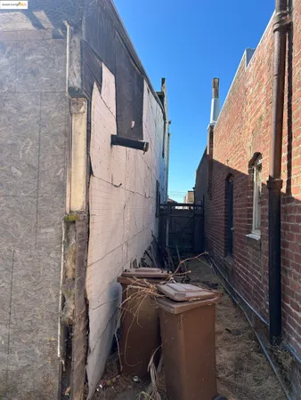 a view of a house with a wooden wall