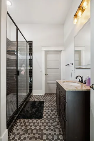 an aerial view of residential houses with outdoor space and trees