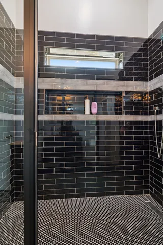 an aerial view of residential houses with outdoor space and trees