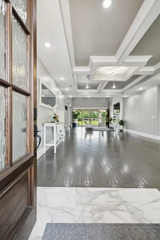 a view of a room with wooden floor