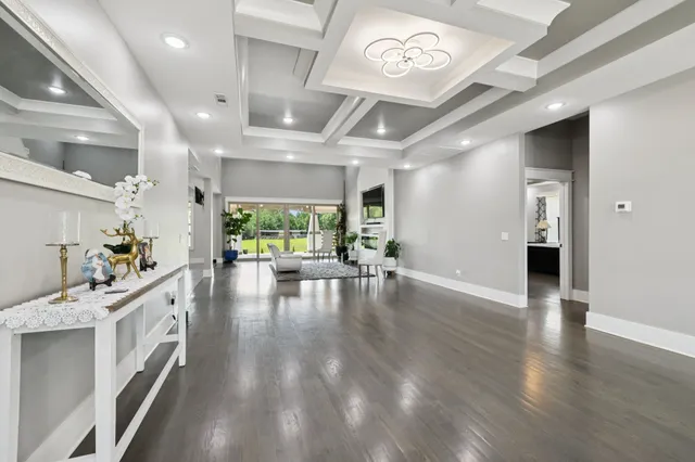 a living room with fireplace furniture and a flat screen tv