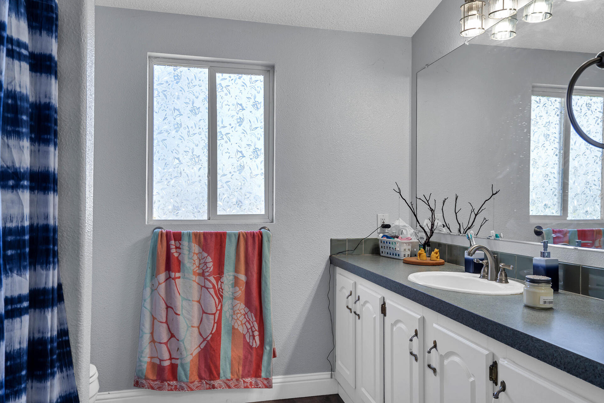 27127 Swede Creek Road Oak Run, CA 96069 - Photo 23 of 33 a bathroom with a sink a mirror and shower curtain