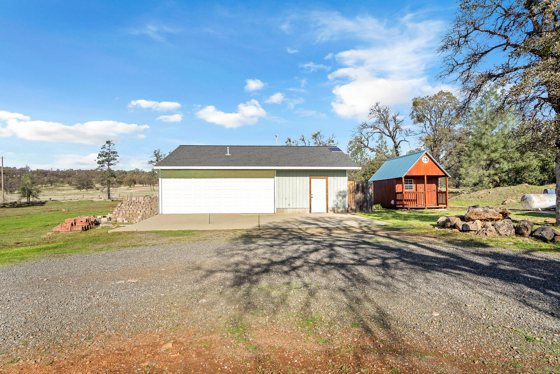 27127 Swede Creek Road Oak Run, CA 96069 - Photo 32 of 33 a view of a house with a yard and sitting area