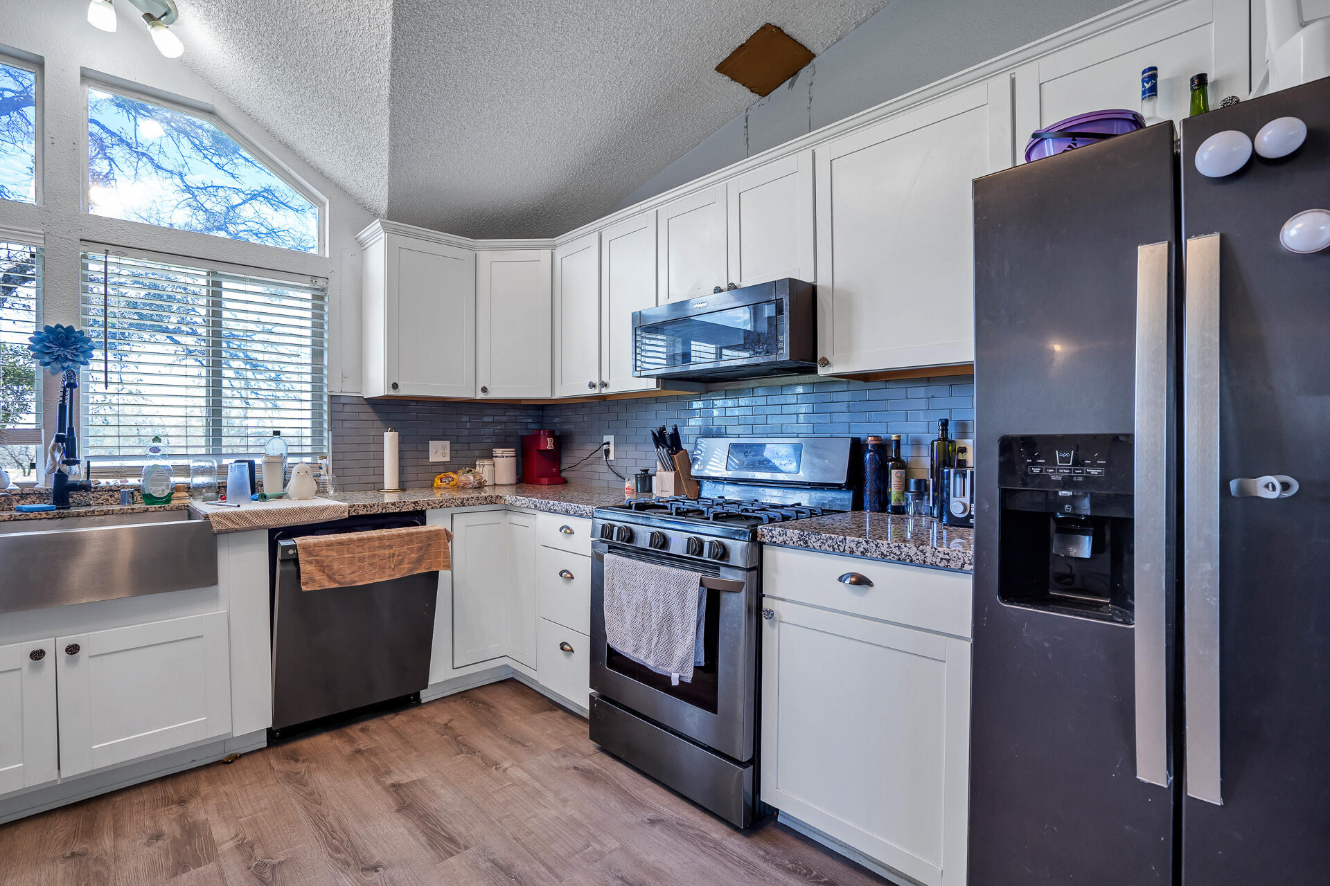 27127 Swede Creek Road Oak Run, CA 96069 - Photo 5 of 33 a kitchen with stainless steel appliances granite countertop a refrigerator sink and stove