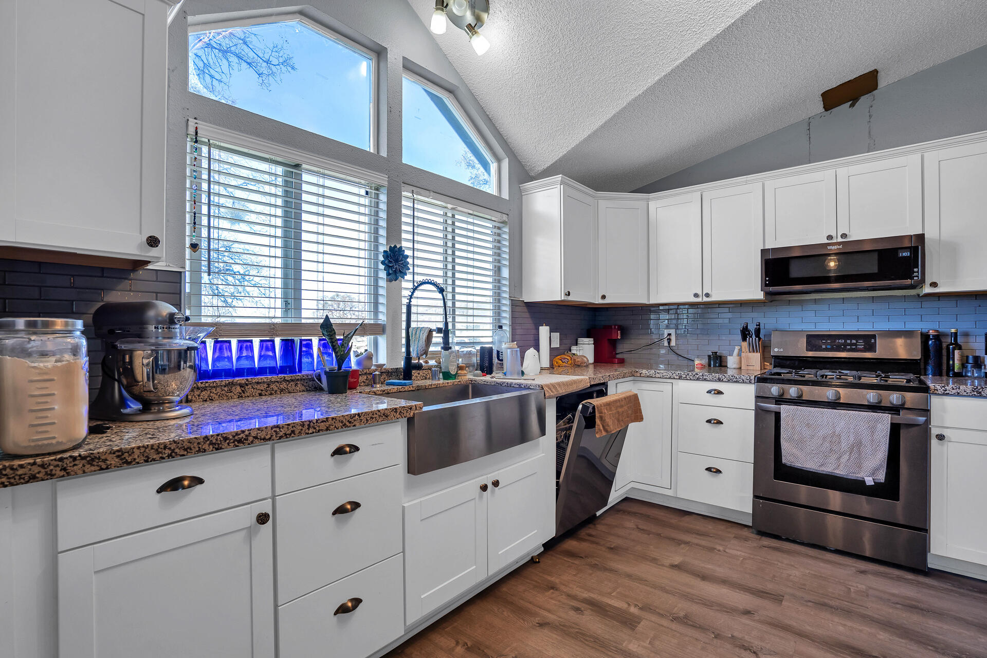27127 Swede Creek Road Oak Run, CA 96069 - Photo 8 of 33 a kitchen with stainless steel appliances granite countertop a sink a stove and cabinets