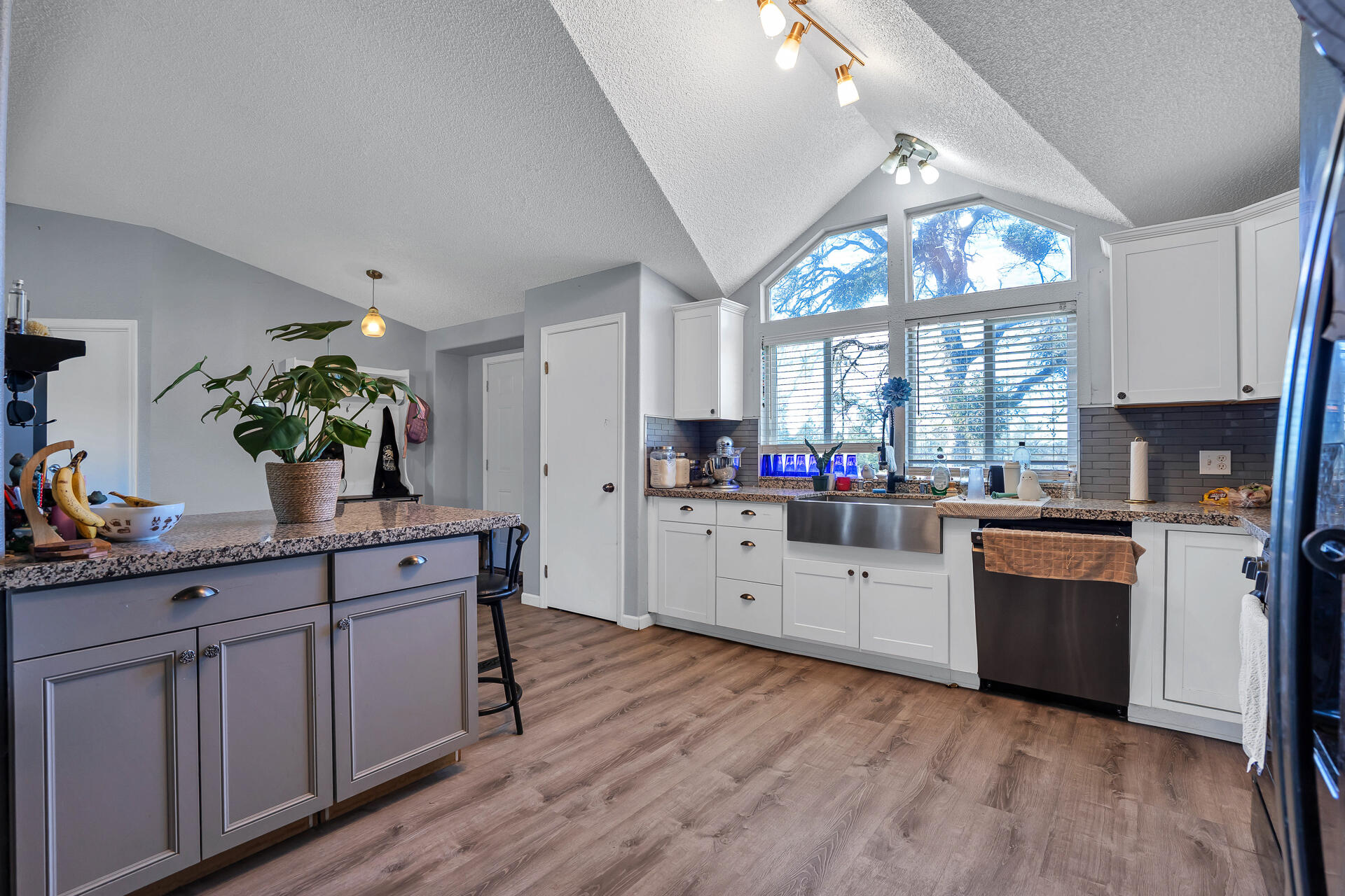 27127 Swede Creek Road Oak Run, CA 96069 - Photo 10 of 33 a kitchen with granite countertop stainless steel appliances sink cabinets and wooden floor
