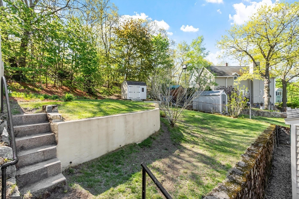 25 Naples Road Melrose, MA 02176 - Photo 22 of 36 a view of a backyard with plants