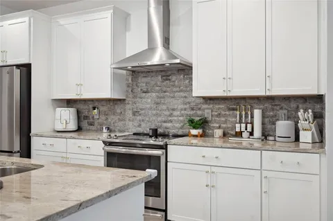 a view of a livingroom with furniture and a window