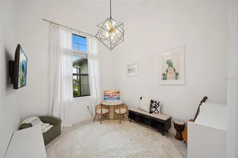 a spacious bedroom with a bed and window