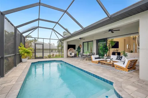 a house with swimming pool in front of it