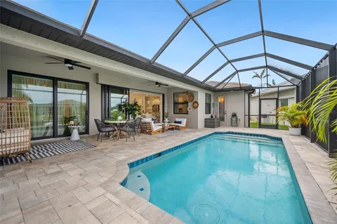 a view of swimming pool with outdoor seating