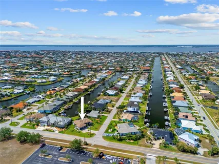 a view of a house with a yard and plants