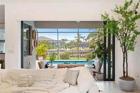 a kitchen with stainless steel appliances kitchen island granite countertop a sink and a refrigerator