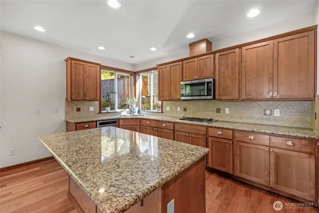 an empty room with furniture and natural light